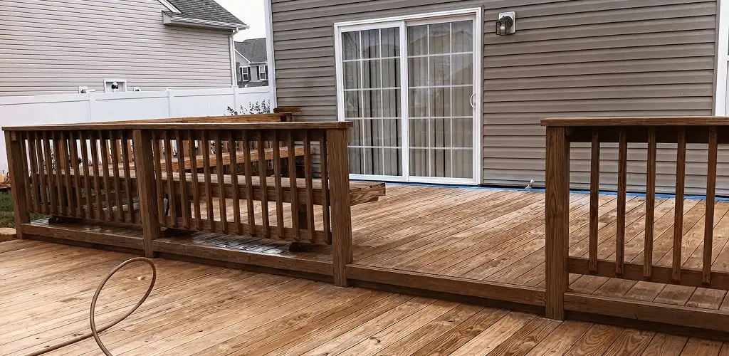 Deck sealing service protecting a backyard wood deck and railings in Savannah, GA