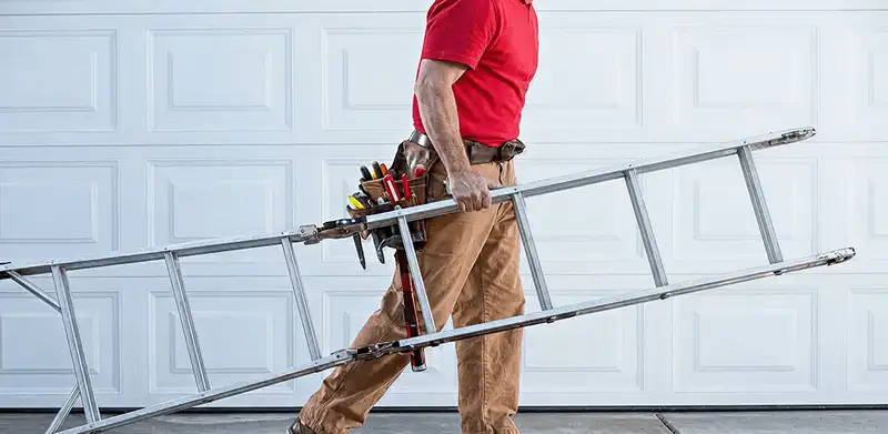 Garage door repair technician arriving with tools and ladder in Savannah, GA